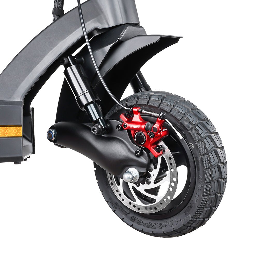Close-up of the front wheel of the Cruiser V2 with the red brake caliper bolted to the arm